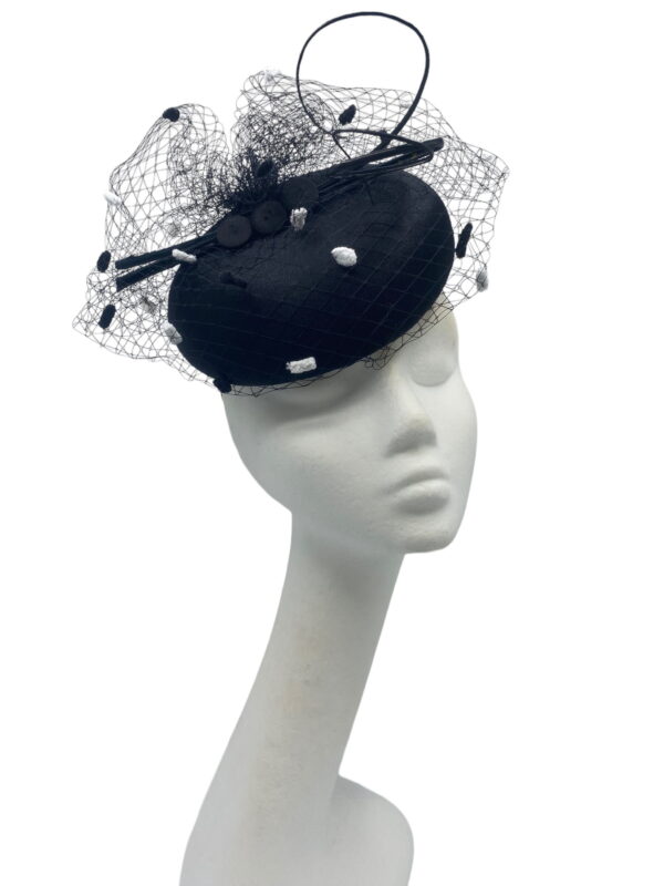 Stunning simple litlle black pillbox with gorgeous monochrome pompom veiling overlay.